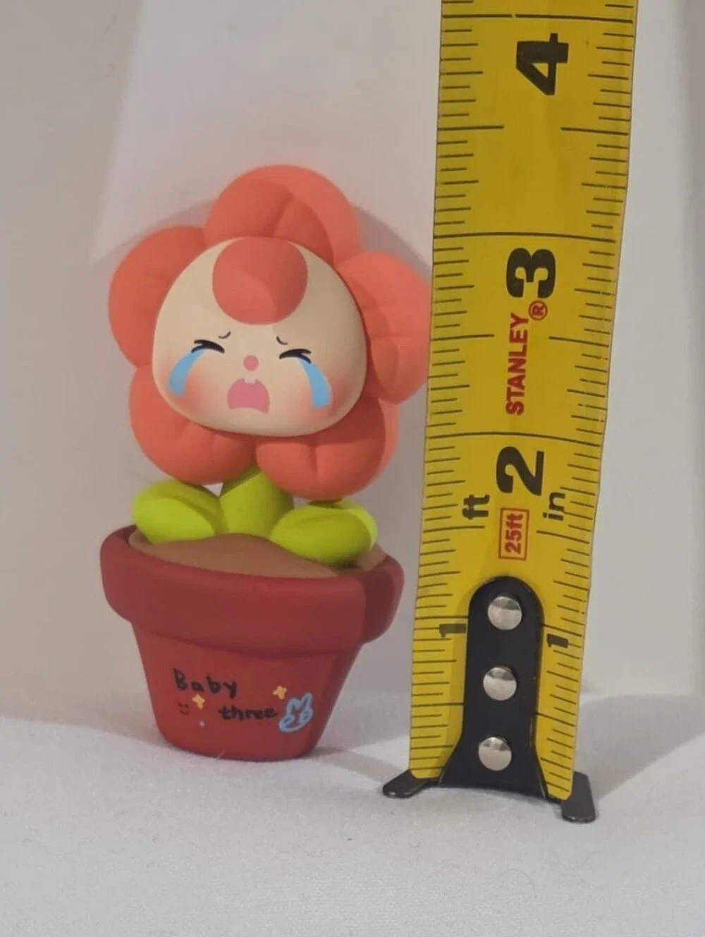 Baby Three crying flower mini figure